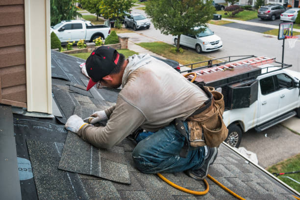 Professional Roof Replacement technician working in Marshfield Hills, MA